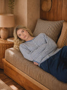 Blue Lottie Striped Knit Cardigan featuring a relaxed, slightly cropped fit, round neckline, long sleeves, button-front closure, and classic horizontal stripe pattern.