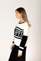 Black-and-white crewneck sweater featuring bold “LES ALPES” lettering across the front and a relaxed fit.
