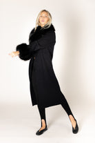Make a statement this season with the elevated Vicki Fur Coat, designed with luxurious eco faux fur trim at the collar and cuffs for a touch of timeless glamour. Featuring a flattering longline silhouette, a classic notch collar, and a refined three-button closure, this sophisticated coat combines elegance with everyday wearability. Crafted to keep you warm while elevating any outfit, it's the perfect outerwear piece for both special occasions and everyday sophistication.

**Care:** Hand wash cold. Lay flat