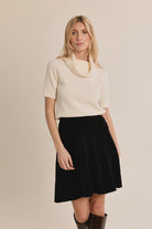 Short-sleeve knitted sweater featuring a cowl neckline and a flattering slim-fit silhouette.