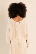 Long-sleeve V-neck sweater featuring a straight fit and delicate lace bow detail at the back.