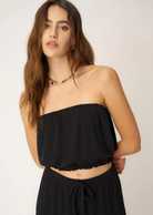 Project Social T Never Better Tube Top. The Never Better Textured Bubble Tube Top features a comfy rib fabric that drapes in all the right places. This strapless, relaxed silhouette is extra flattering thanks to the elasticized bubble hemline. A cropped fit and merrow hemline are the finishing touches that make this extra special.