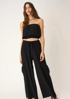 Project Social T Never Better Textured Wide Leg Pant. You'll truly never find a better pant.  Our Never Better Textured Wide Leg Pant features a flowy fit that is perfect for warmer weather. The textured rib fabric perfectly complements the wide leg silhouette. Complete with an elasticized mid waist, functional drawcord, cargo side pockets, and merrow hemline, what more could you ask for in a summer pant?