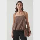 woman wearing a brown bubble hem tank top