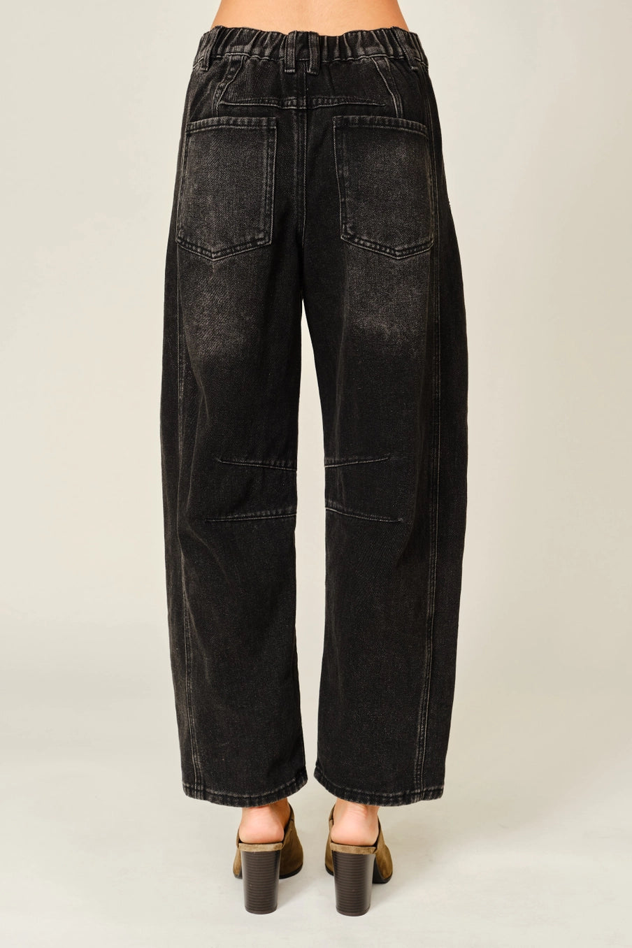 Women’s washed black barrel jeans featuring tonal floral embroidery, high-rise waist, five-pocket styling, relaxed curved leg, and cropped ankle-length fit.