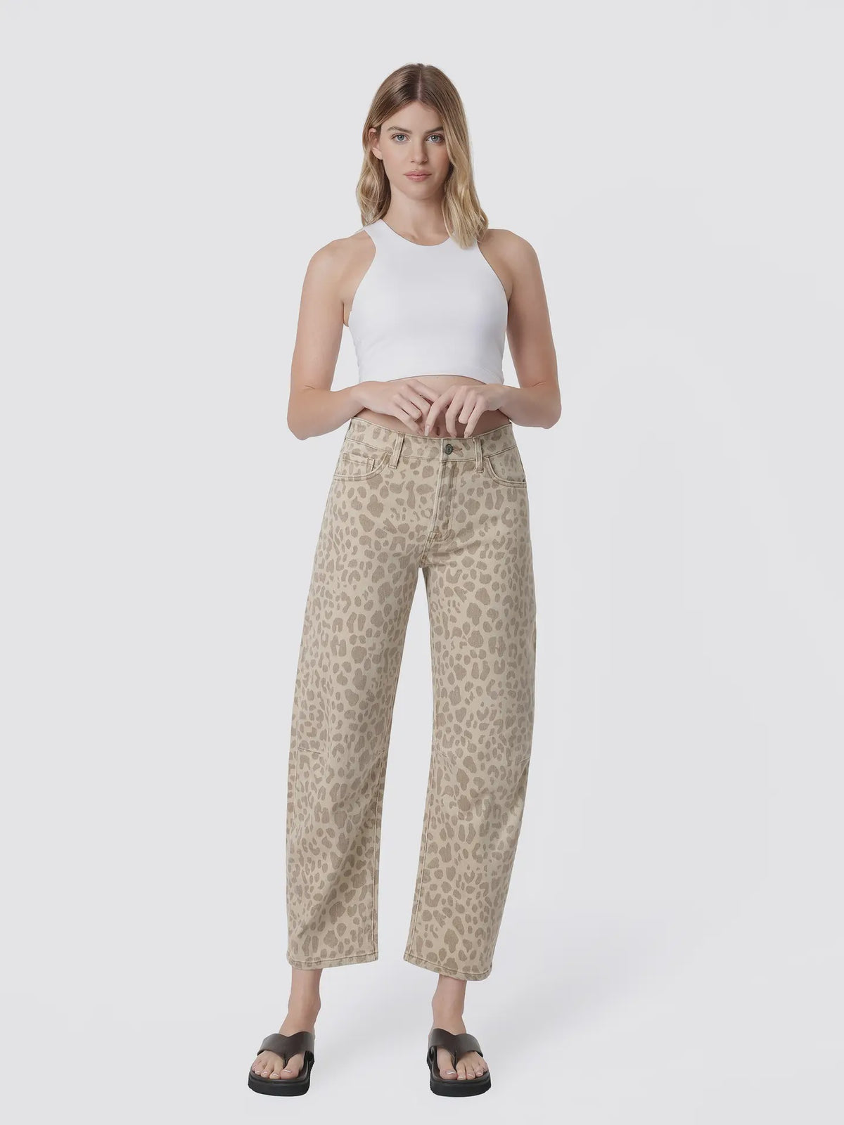 Women’s high-rise barrel jeans in a beige leopard print featuring a relaxed curved-leg fit, five-pocket styling, and cropped ankle length.