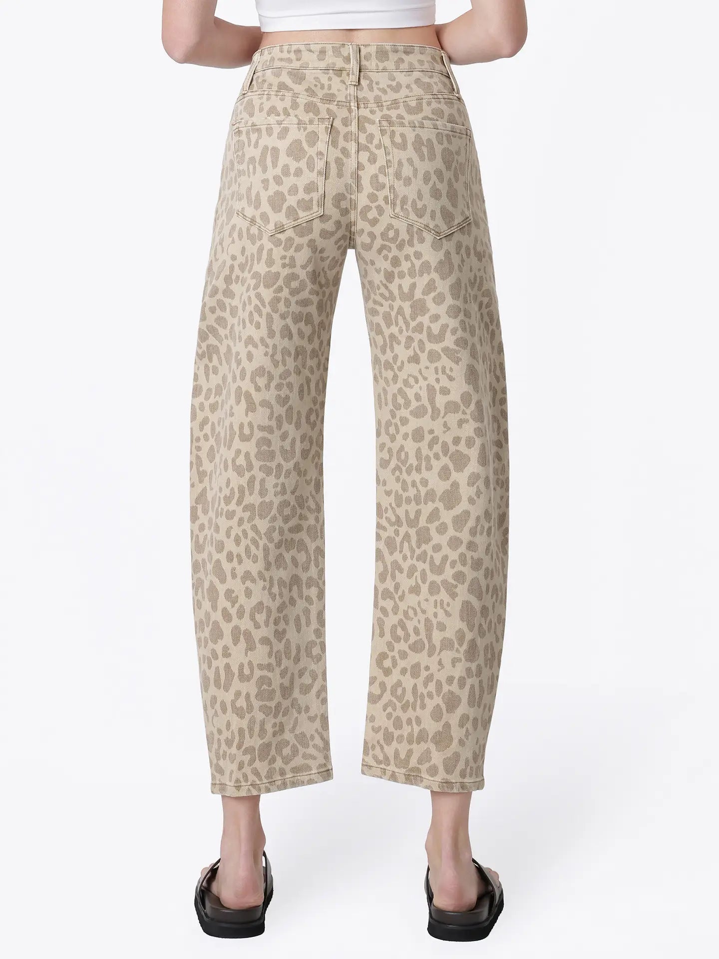 Women’s high-rise barrel jeans in a beige leopard print featuring a relaxed curved-leg fit, five-pocket styling, and cropped ankle length.