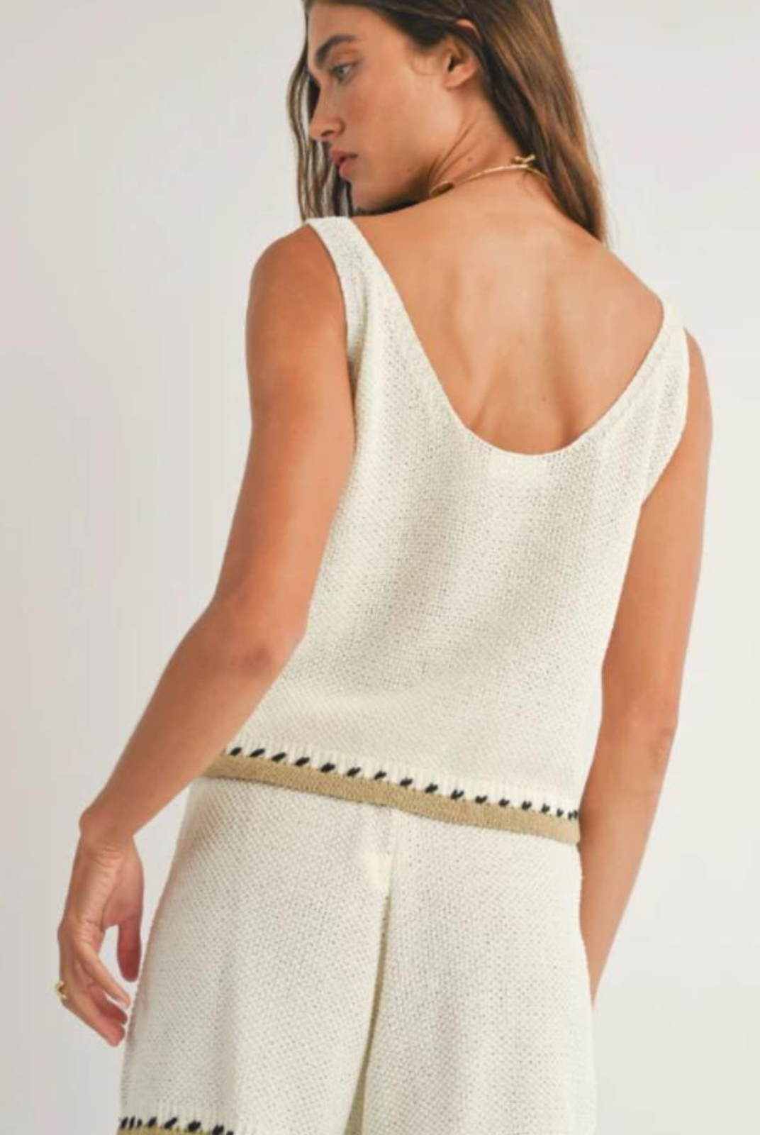 Sage The Label Rhode Sweater Tank. Upgrade your summer wardrobe with the Rhode Sweater Tank. This light weight, sleeveless tank features a scallop edge design and casual knit fabric. Pair it with the matching Rhode Knit Shorts for a complete look. Stay stylish and cool all season long!