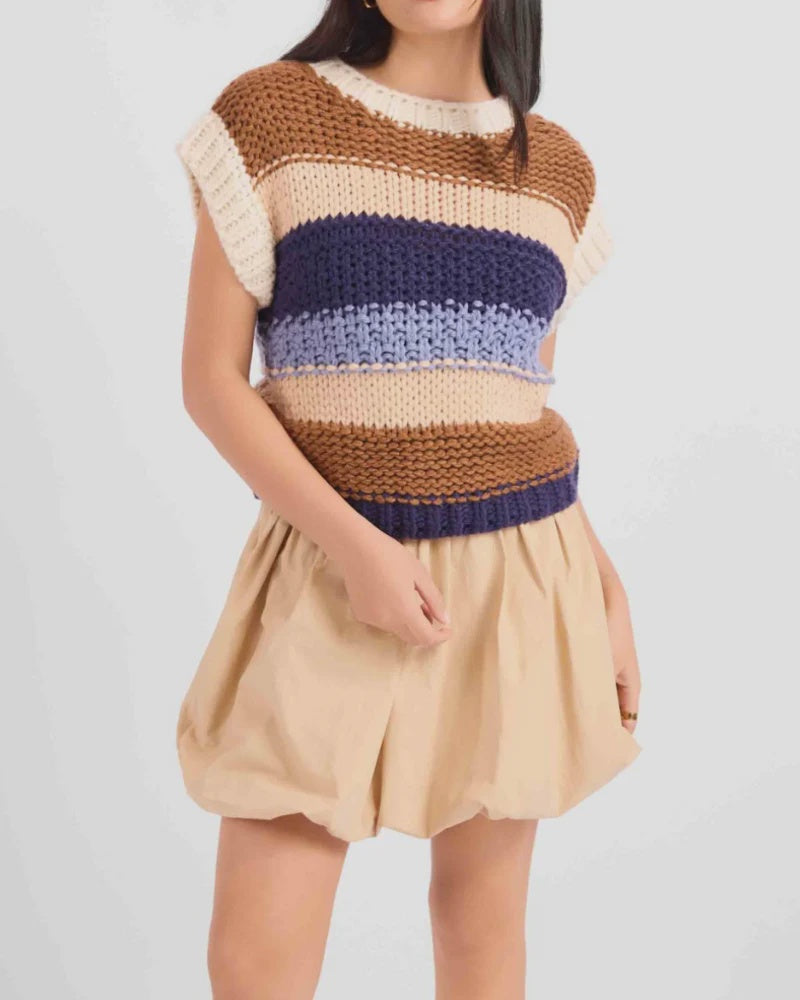 Sleeveless chunky knit top featuring a warm multi-colour stripe pattern, cozy textured finish, and relaxed, slightly boxy fit.