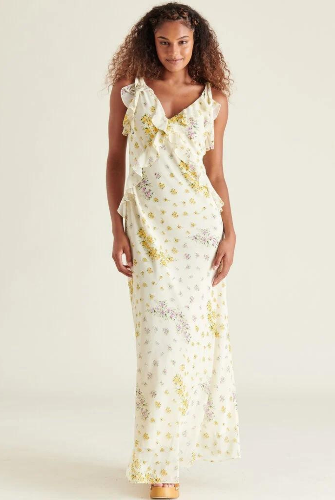 Steve Madden Adalina Dress. Be the center of attention in the stunning ADALINA dress. This desert floral printed chiffon dress features a v-neckline and ruffle detail that will make you stand out on any occasion. With its sleeveless design, this multicolor maxi dress is the perfect addition to your spring wardrobe.