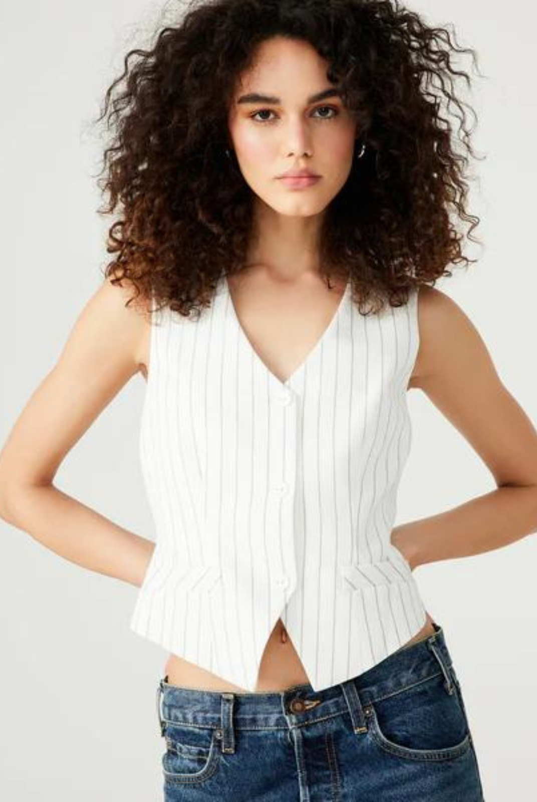 Steve Madden Selena Vest.Elevate your business attire with the SELENE vest. This stylish pinstripe vest top features a three-button closure for a menswear-inspired look. Tailored for a professional fit, this vest is a must-have for modern business fashion.
