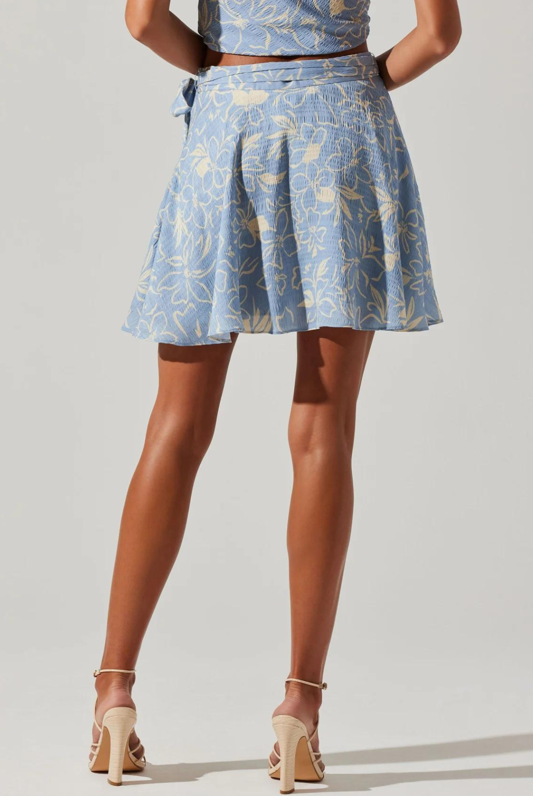 ASTR The Label Tazia Skirt. Sketched floral design Fitted at waist with relaxed skirt Concealed side zipper with side tie detail The Tazia Skirt pairs well with the Tazia Top.