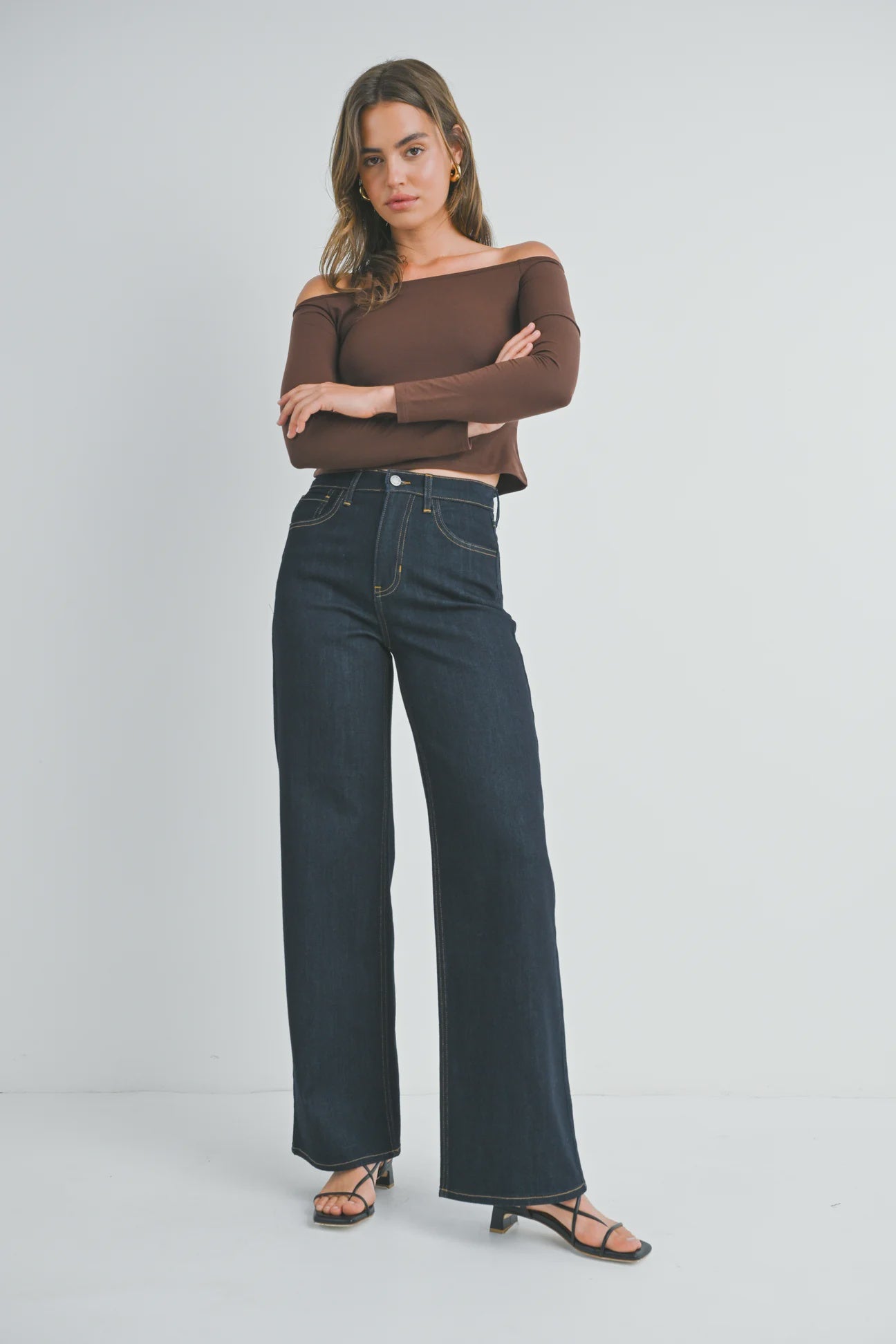 woman wearing dark wash
 high rise wide leg jeans