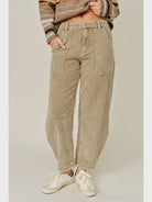Thea Corduroy Barrel Pants in Taupe featuring a high-rise waist, relaxed barrel-leg silhouette, soft textured corduroy fabric, oversized front patch pockets, subtle seam detailing, and tapered ankle-length hems.