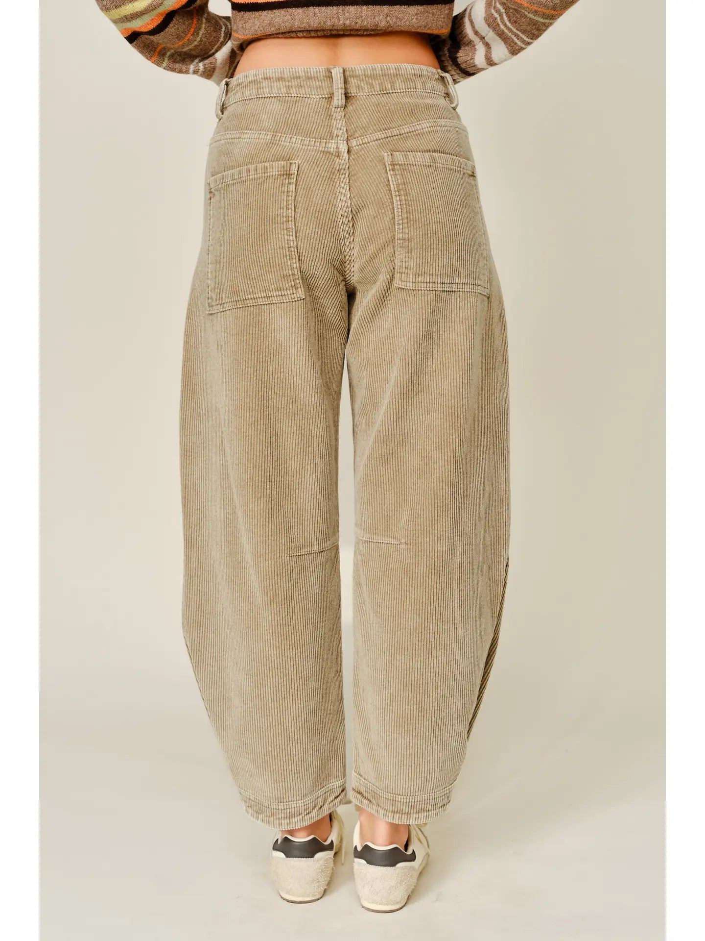 Thea Corduroy Barrel Pants in Taupe featuring a high-rise waist, relaxed barrel-leg silhouette, soft textured corduroy fabric, oversized front patch pockets, subtle seam detailing, and tapered ankle-length hems.