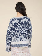 Women’s navy and cream printed knit pullover featuring an all-over pattern, relaxed fit, long sleeves, and contrast ribbed trim.