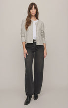 Relaxed crewneck cardigan crafted from cozy sweater yarn with a classic button-front closure and easy layering silhouette.