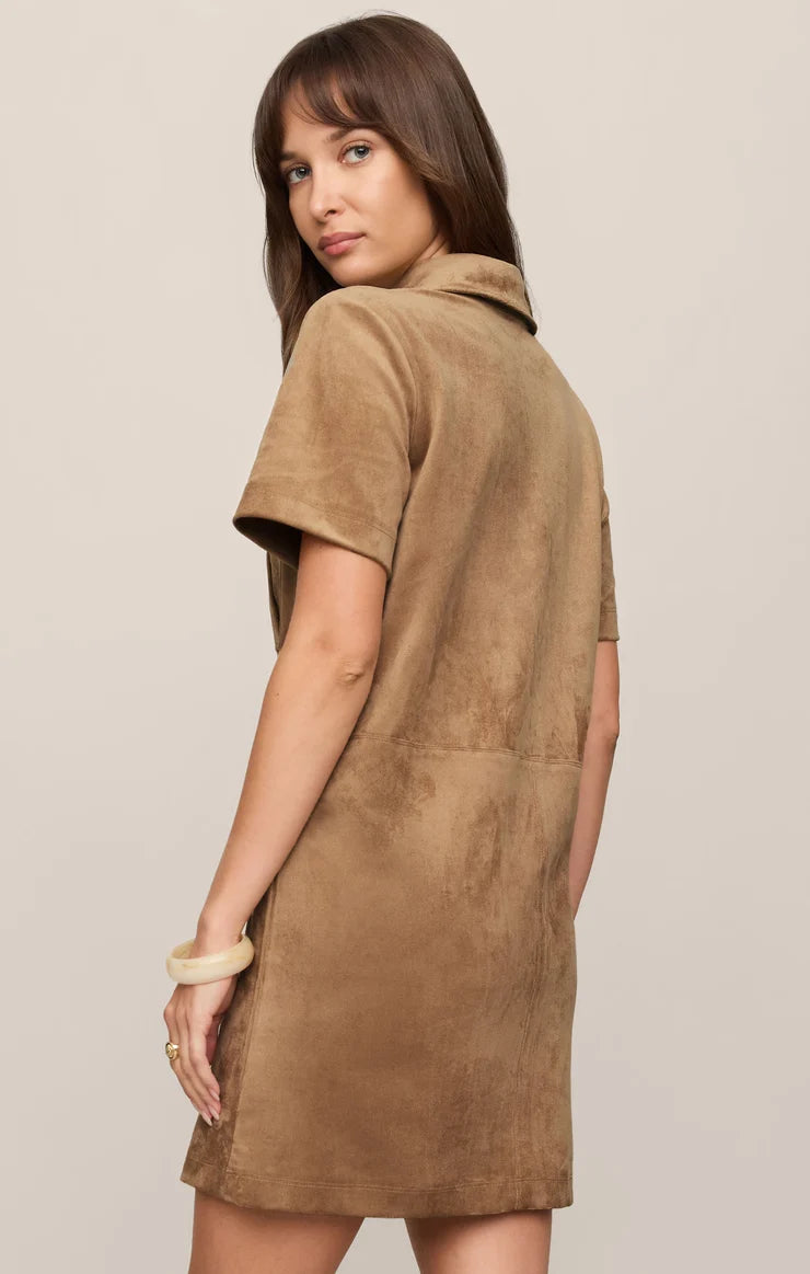 Faux suede mini shift dress featuring a collared neckline, short sleeves, front snap-button closures, chest and front patch pockets, and a relaxed fit.