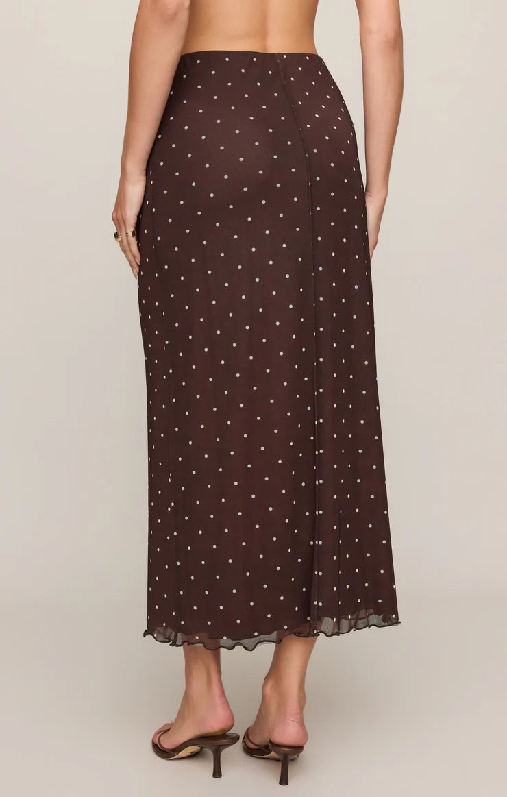 Brown mesh midi skirt with white polka dots, featuring a high-rise elastic waistband, lettuce-edge hem, and fully lined silhouette.
