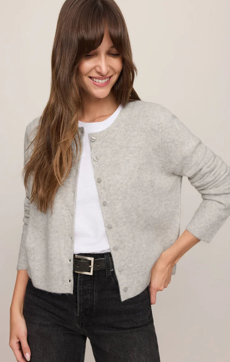 Relaxed crewneck cardigan crafted from cozy sweater yarn with a classic button-front closure and easy layering silhouette.