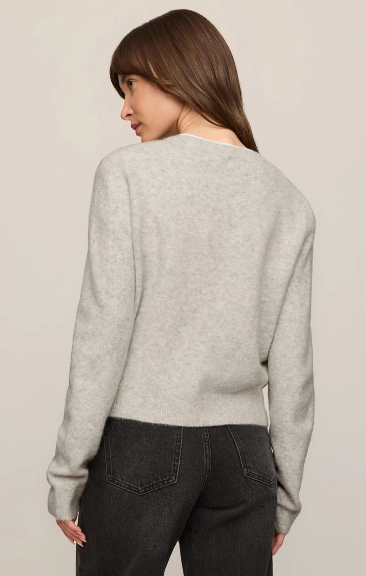 Relaxed crewneck cardigan crafted from cozy sweater yarn with a classic button-front closure and easy layering silhouette.