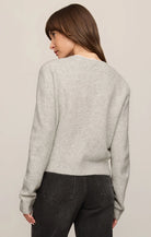 Relaxed crewneck cardigan crafted from cozy sweater yarn with a classic button-front closure and easy layering silhouette.