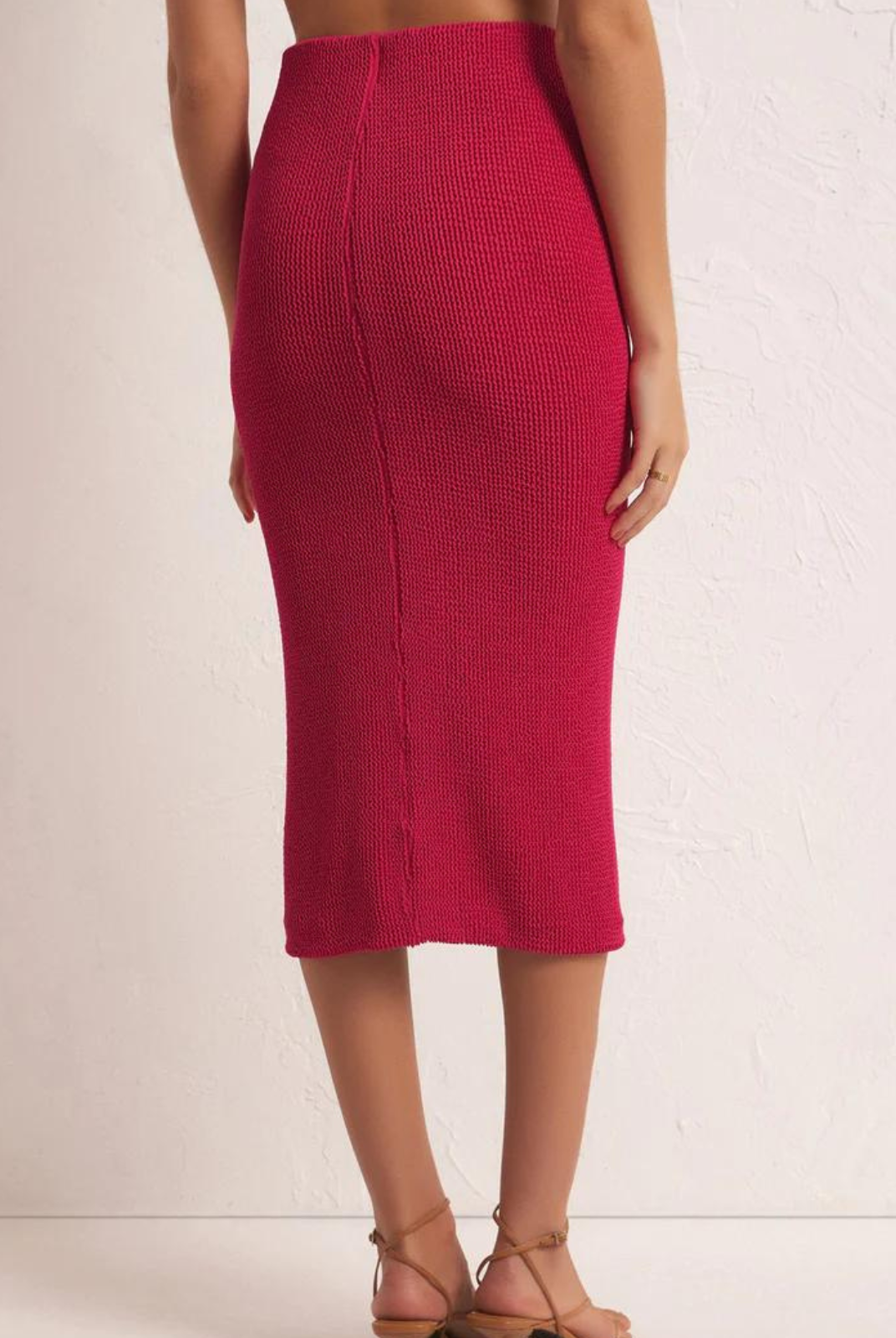 Z Supply Aveen Midi Skirt. Sleek and sultry, this midi will become your fave go-to, from interviews to nights out. The hidden elastic waistband makes this skirt easy to pull on and the mid-weight knit is made for everyday wear.