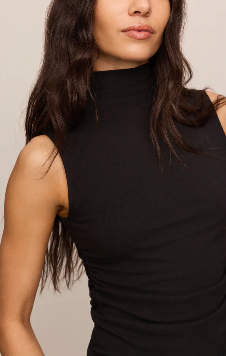 Close-fitting high-neck tank top in soft, stretchy baby rib fabric with subtle side ruching for a flattering, sculpted silhouette. A sleek, fitted essential that's perfect for layering or wearing on its own.
