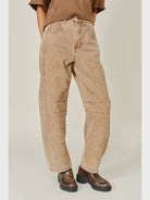 The Ophelia Embroidered Barrel Jeans in rust, featuring tonal floral embroidery, a relaxed barrel-leg silhouette, and a cropped ankle-length fit.
