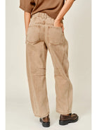 The Ophelia Embroidered Barrel Jeans in rust, featuring tonal floral embroidery, a relaxed barrel-leg silhouette, and a cropped ankle-length fit.
