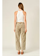 Women’s camel corduroy trousers featuring a subtle barrel fit, utility patch pockets, belt loops, and a rope tie waist.
