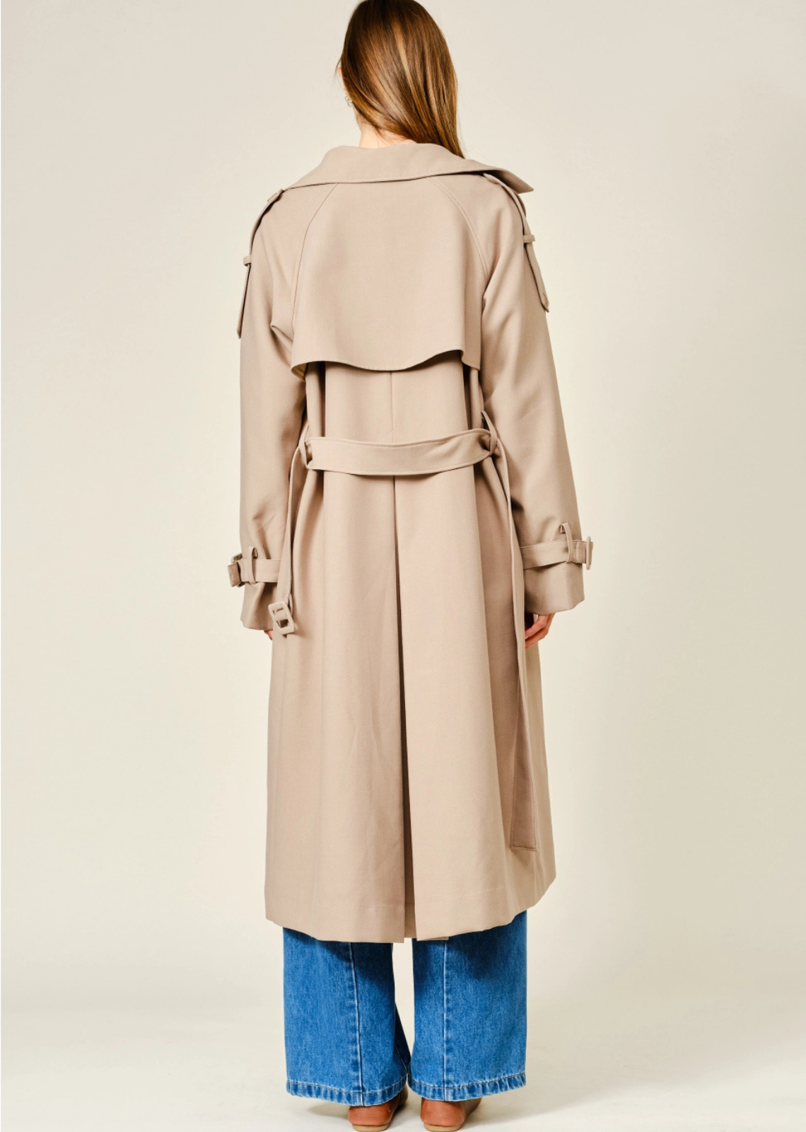 Monroe relaxed longline trench coat in soft, textured fabric, featuring a layered neckline, double-button front closure, and adjustable waist belt for a polished, sophisticated look.