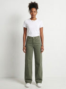 Wide-leg jeans in comfortable stretch denim featuring a relaxed fit, 10-inch rise, and raw-edge hem for a modern, casual look. Versatile style suitable for the office, classroom, or weekend wear.
