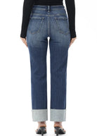 High-rise straight-leg jeans featuring a stitched cuff, sleek silhouette, and comfortable stretch denim for an effortlessly polished everyday look.
