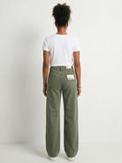 Wide-leg jeans in comfortable stretch denim featuring a relaxed fit, 10-inch rise, and raw-edge hem for a modern, casual look. Versatile style suitable for the office, classroom, or weekend wear.
