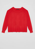 A bright red long-sleeve knit sweater with raglan sleeves.