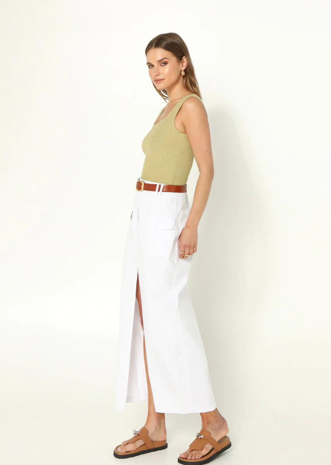 Madison The Label Evan Midi Skirt. White high waisted mini skirt with front split.