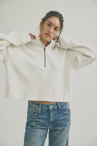 cotton ripped quarter zip sweater in clean ivory. mid length / oversized 
