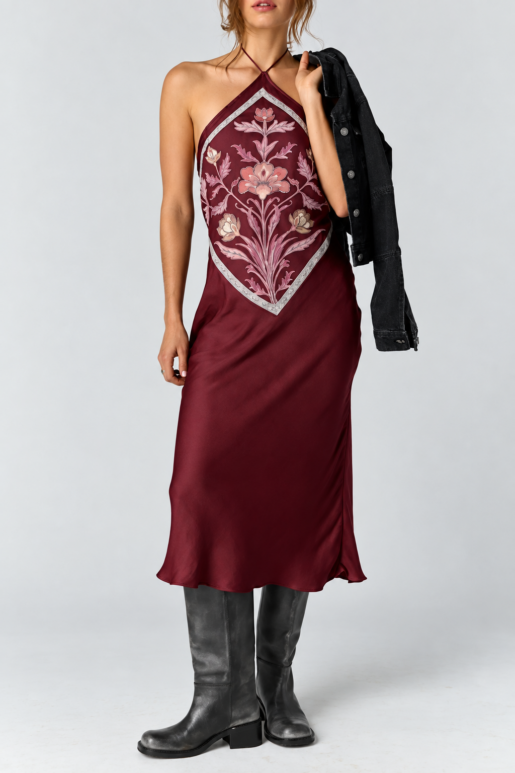 Satin midi dress with an adjustable halter neckline, fit-and-flare silhouette, handkerchief-style bodice, strapless design, and open back. Finished with a smooth satin fabrication and easy pull-on construction.