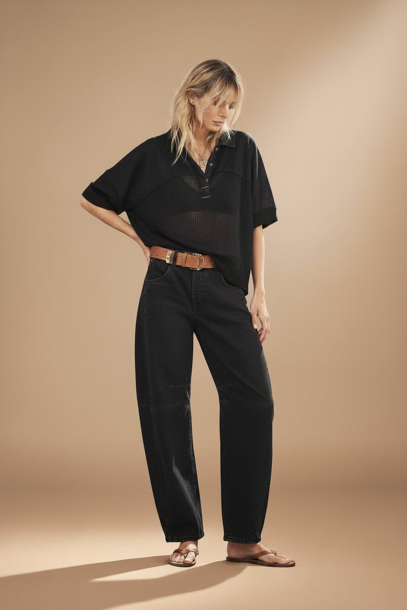 woman wearing washed black mid rise barrel jeans in an ankle length