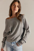 Women's textured thermal long sleeve top with a boat neckline, relaxed dolman sleeves, exposed seam detailing, and elongated cuffs. heather grey.