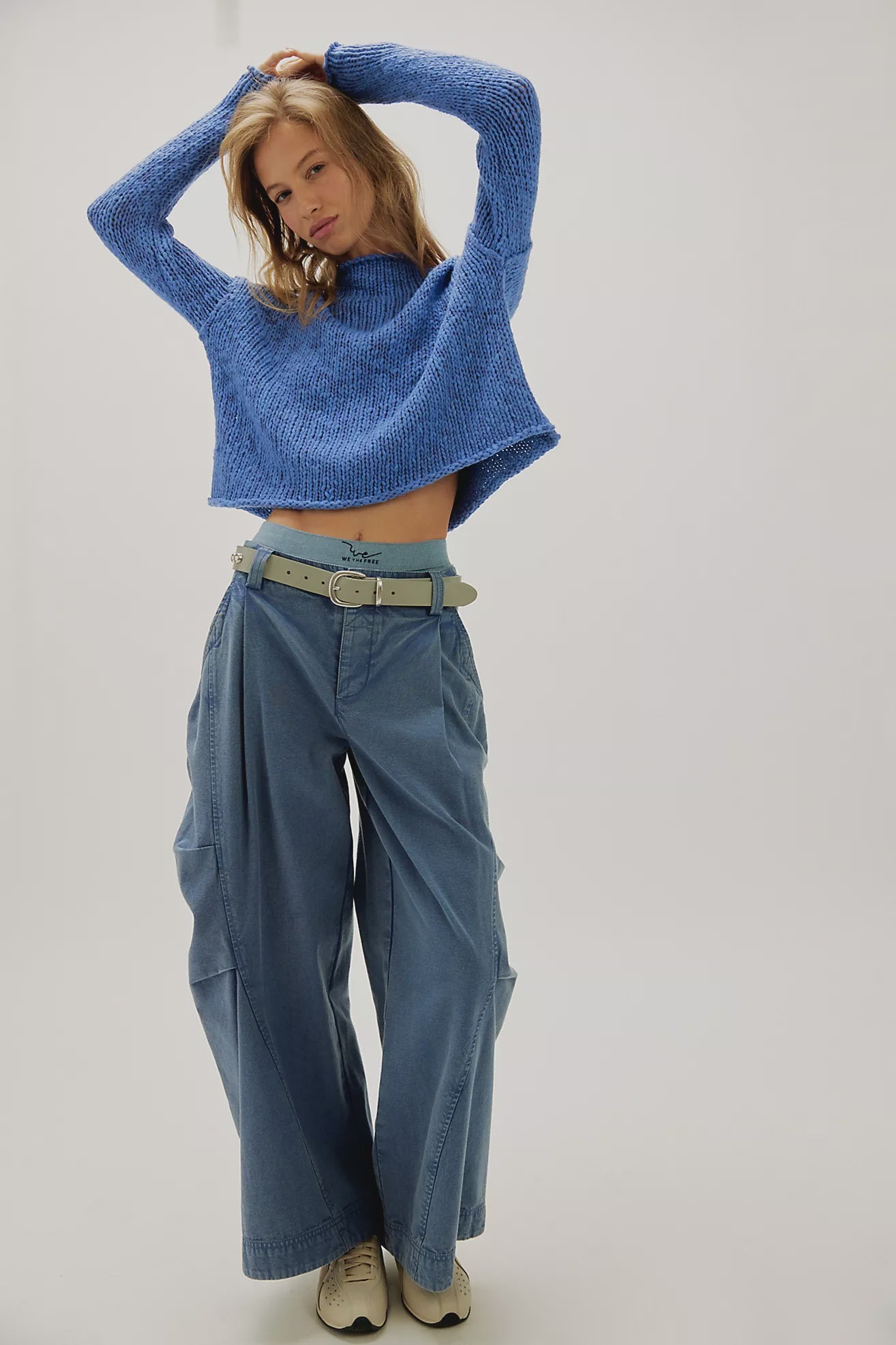 Peri Blue cotton knit sweater with a relaxed boxy fit, rolled neckline, dropped shoulders, and long sleeves.