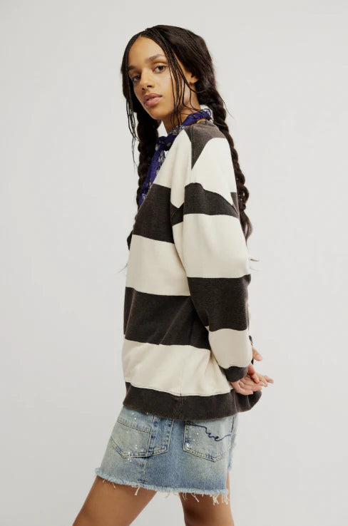 woman wearing black and white striped combo crewneck sweater