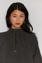 washed black quarter zip sweater. mid length / oversized 