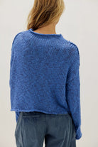 Peri Blue cotton knit sweater with a relaxed boxy fit, rolled neckline, dropped shoulders, and long sleeves.