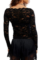 Sheer floral lace long-sleeve top with a fitted silhouette, boat neckline, ribbed trim, and added stretch for a comfortable, body-skimming fit. Base layer sold separately.