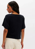 black cowl neck top. mid - full length and loose fitted short sleeves
