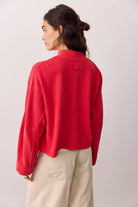 Soft 100% cotton quarter-zip pullover with a slightly cropped, boxy fit, dropped shoulders, long sleeves, and stand collar.