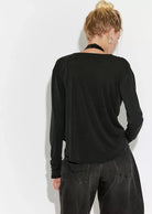 Jane Long Sleeve top featuring a soft, draped cowl neckline that can be styled off the shoulder, long fitted sleeves, and a flattering, body-skimming silhouette with an effortlessly feminine look.