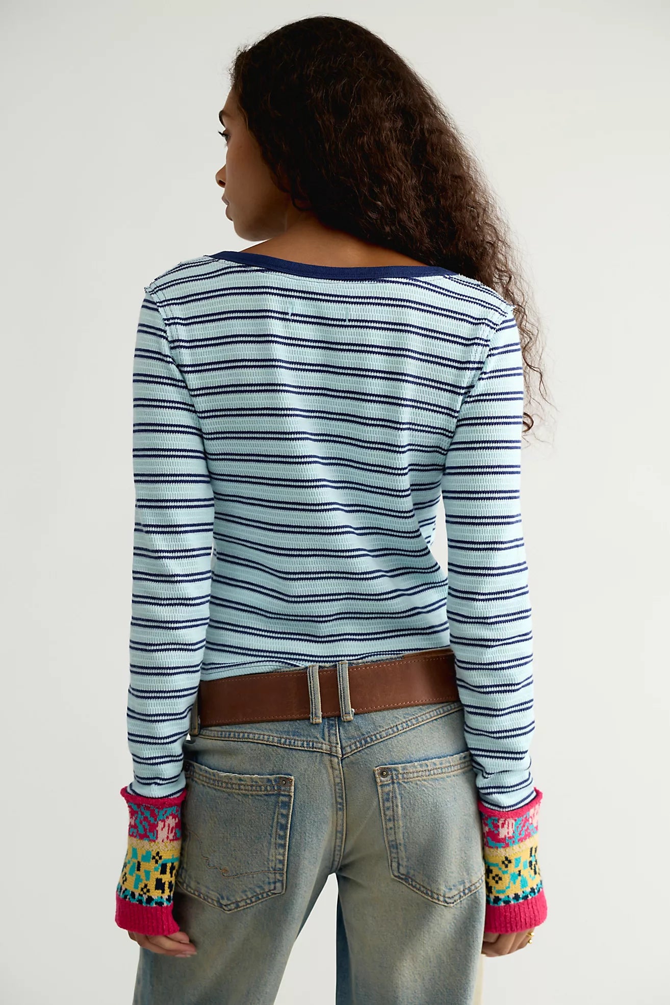 Free People Noa Cardi in Blue Pop Combo featuring a fitted silhouette, soft ribbed cotton fabric, blue and white horizontal stripes, crew neckline, long sleeves, button-front closure, and colourful embroidered detailing along the front panels and cuffs.